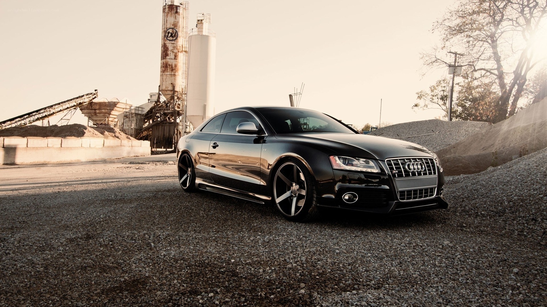black audi coupe in industrial setting