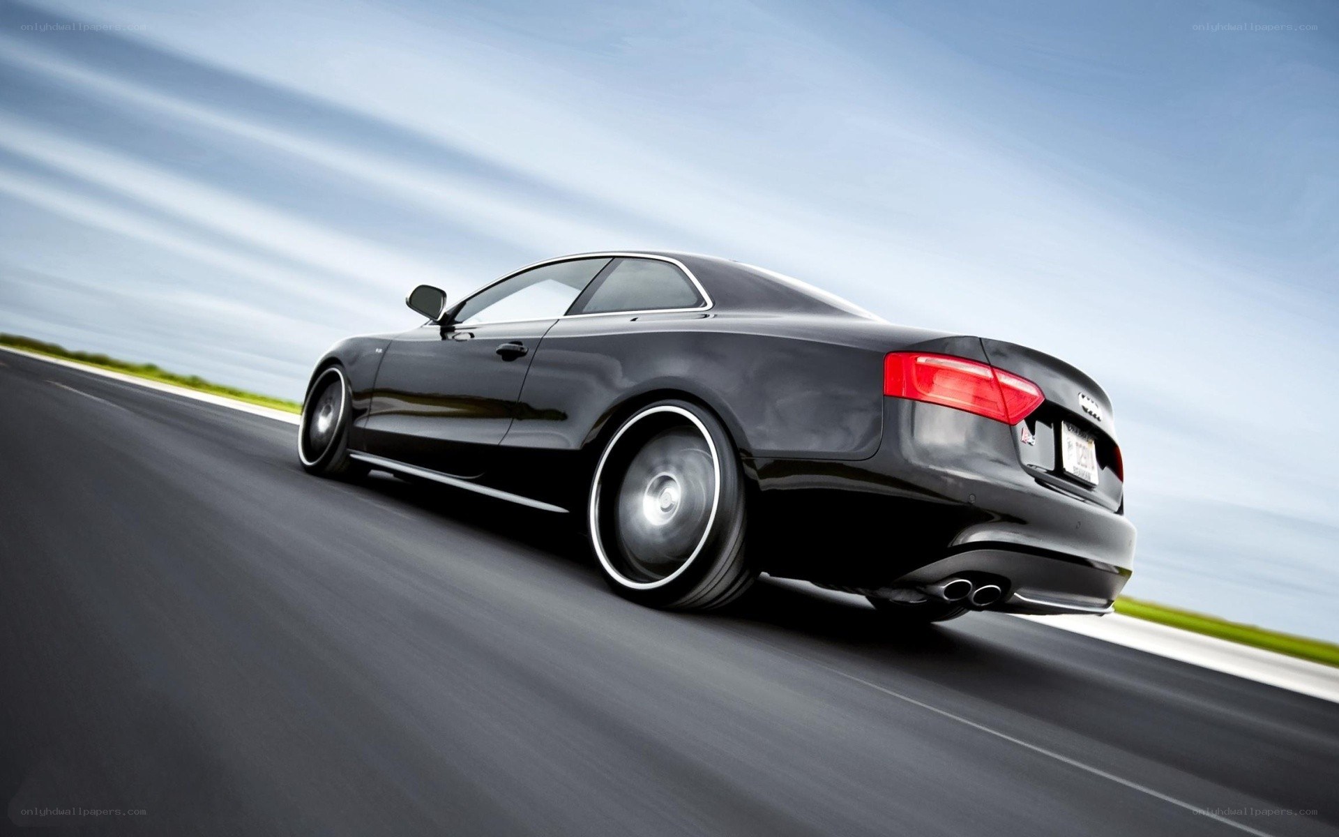 black audi coupe in motion
