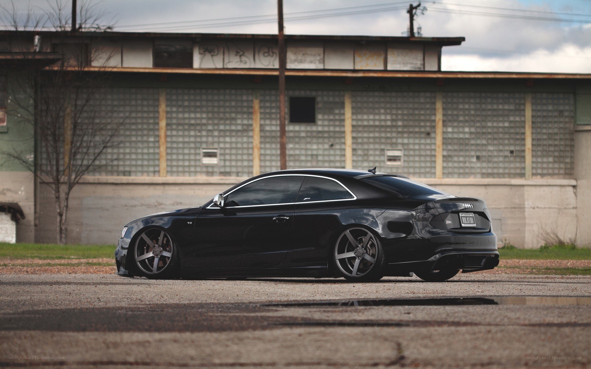 black audi coupe in urban setting