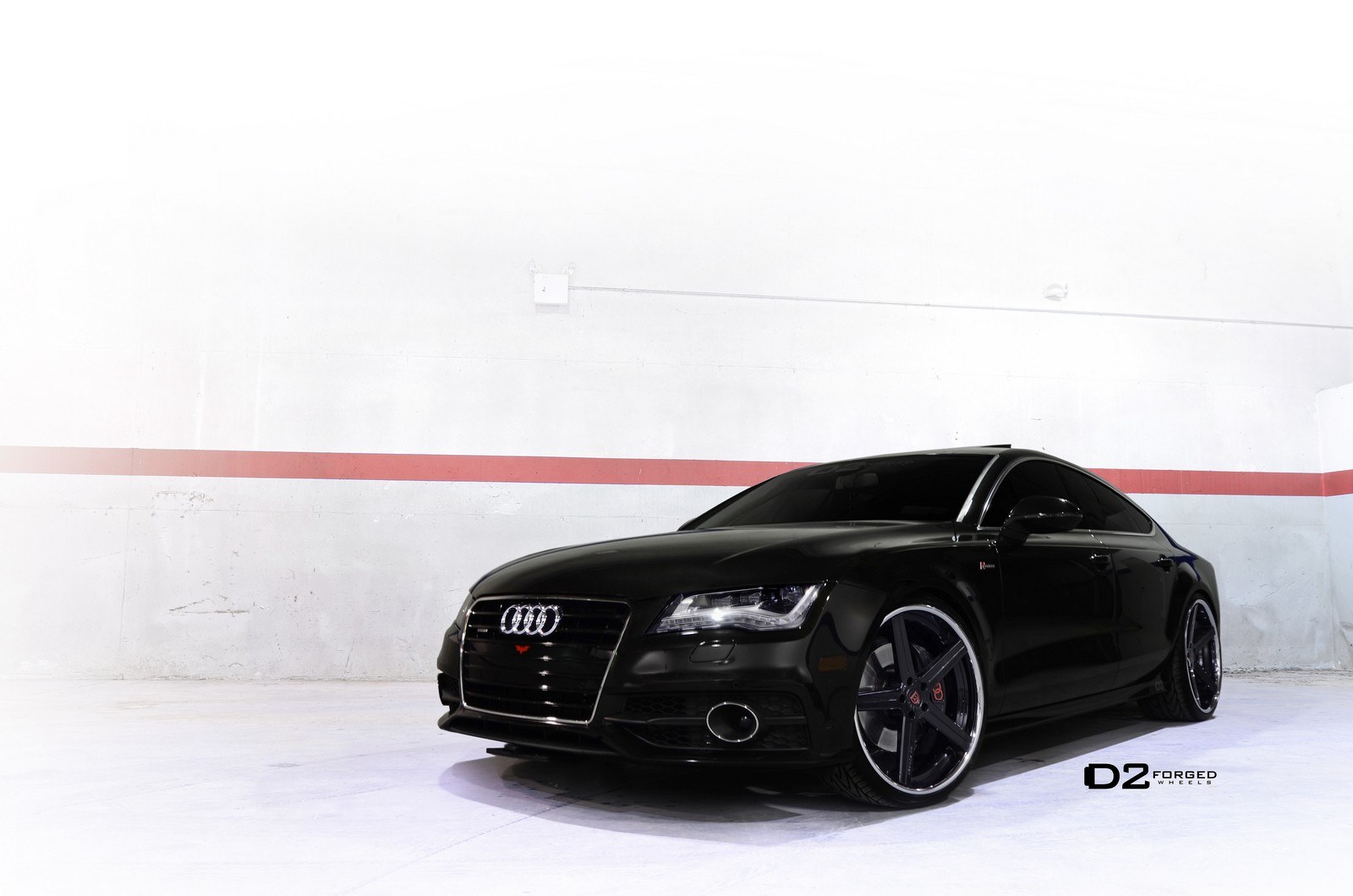 black audi coupe with custom wheels