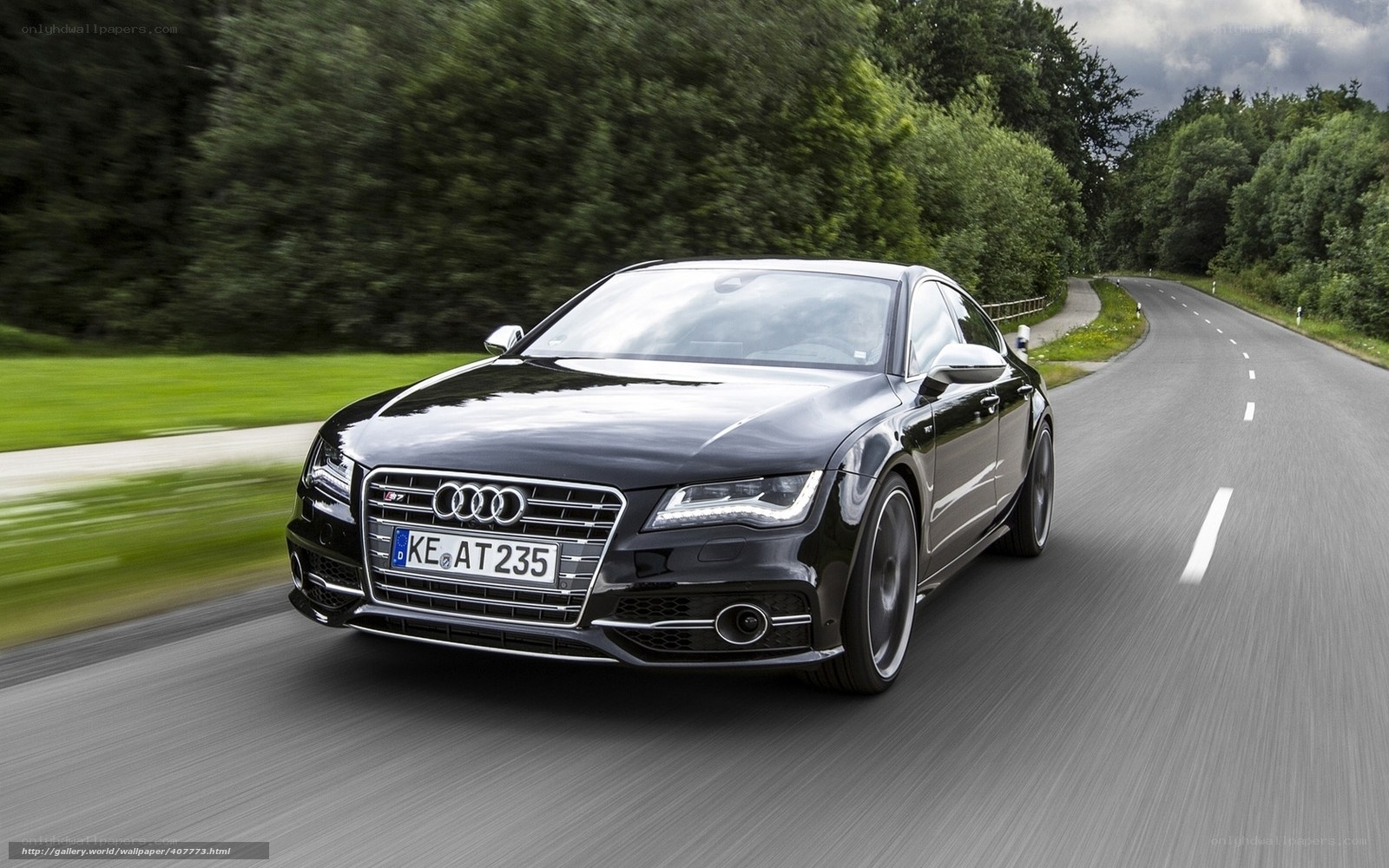 Black Audi driving on a road