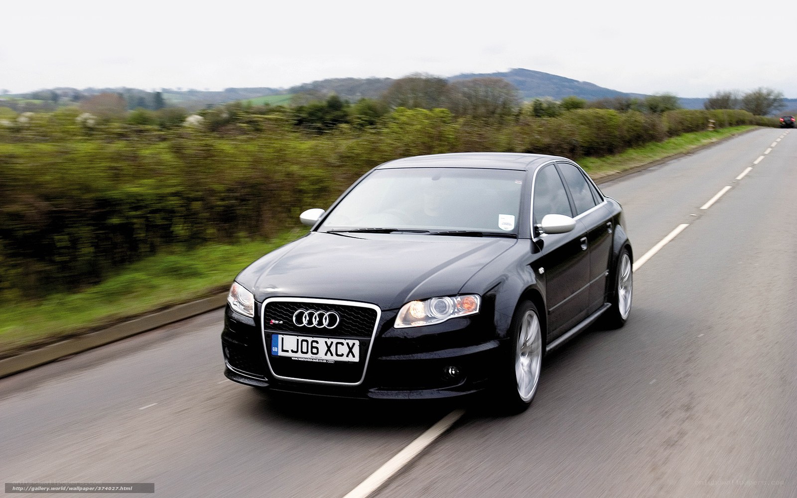 black audi driving on country road