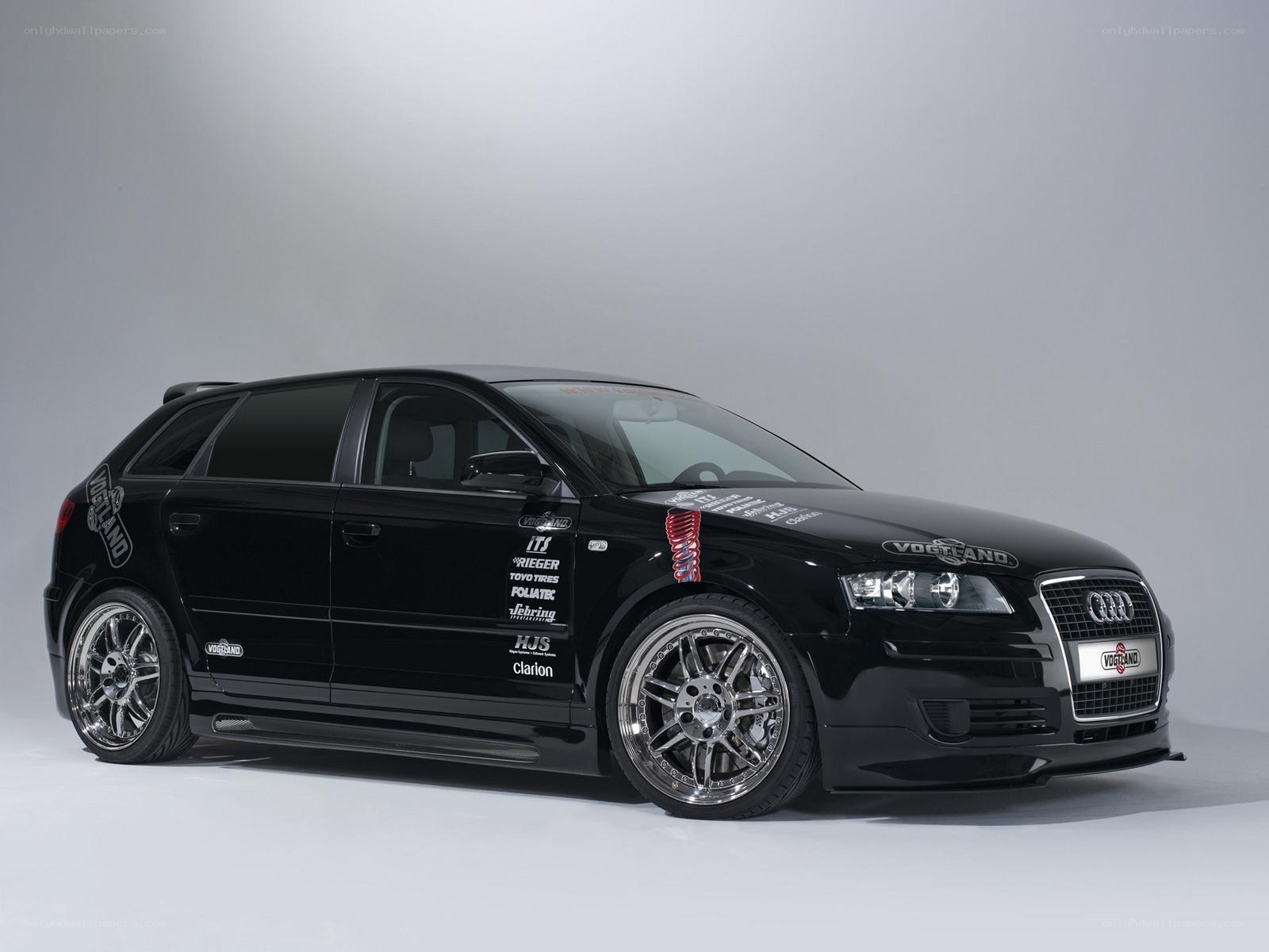 Black Audi hatchback with custom decals