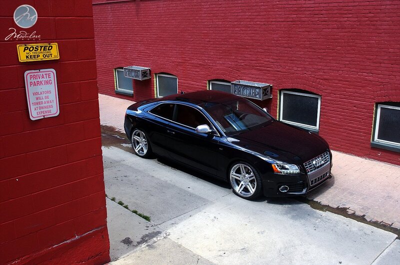 Black Audi in alleyway