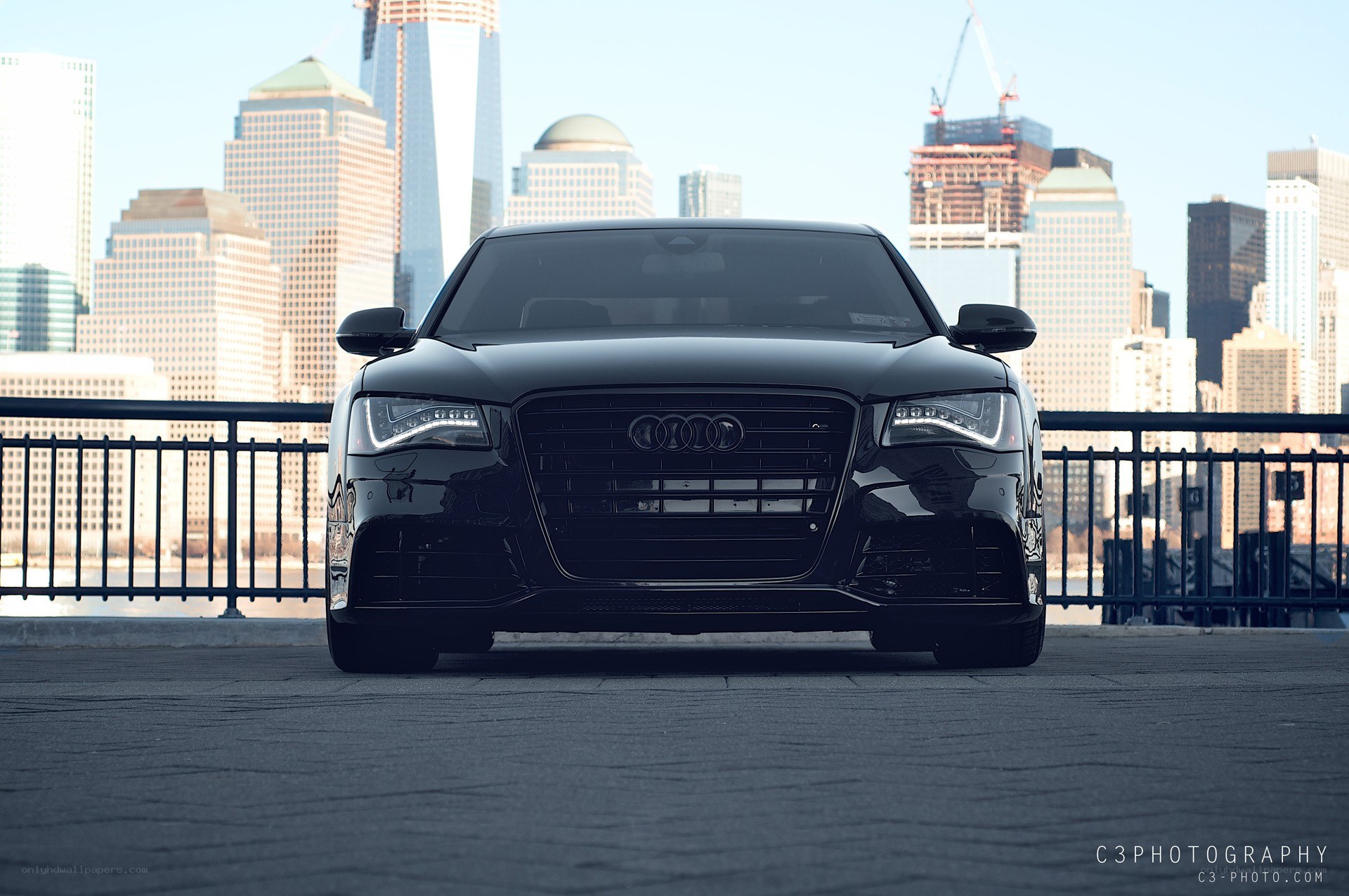 Black Audi in cityscape