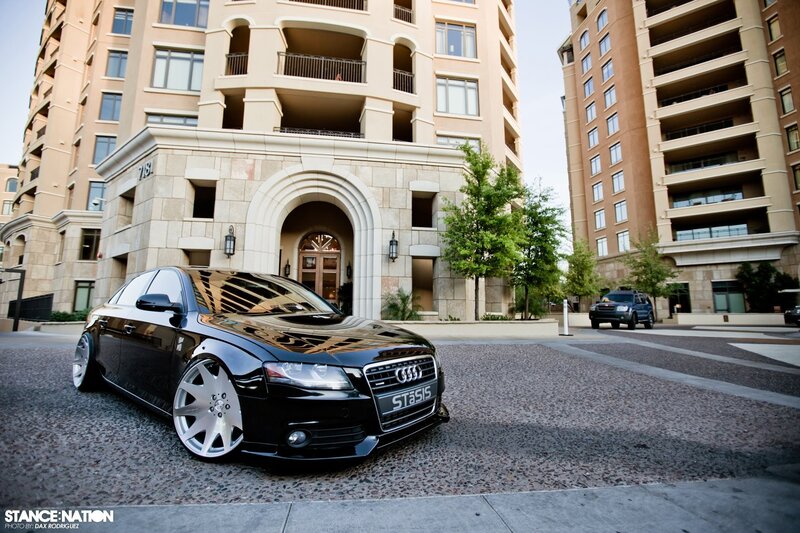 Black Audi in front of apartment building