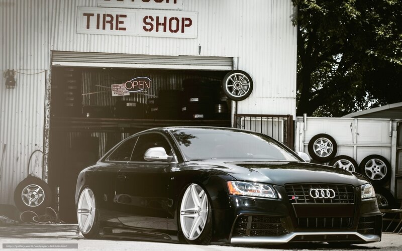 Black Audi in front of tire shop
