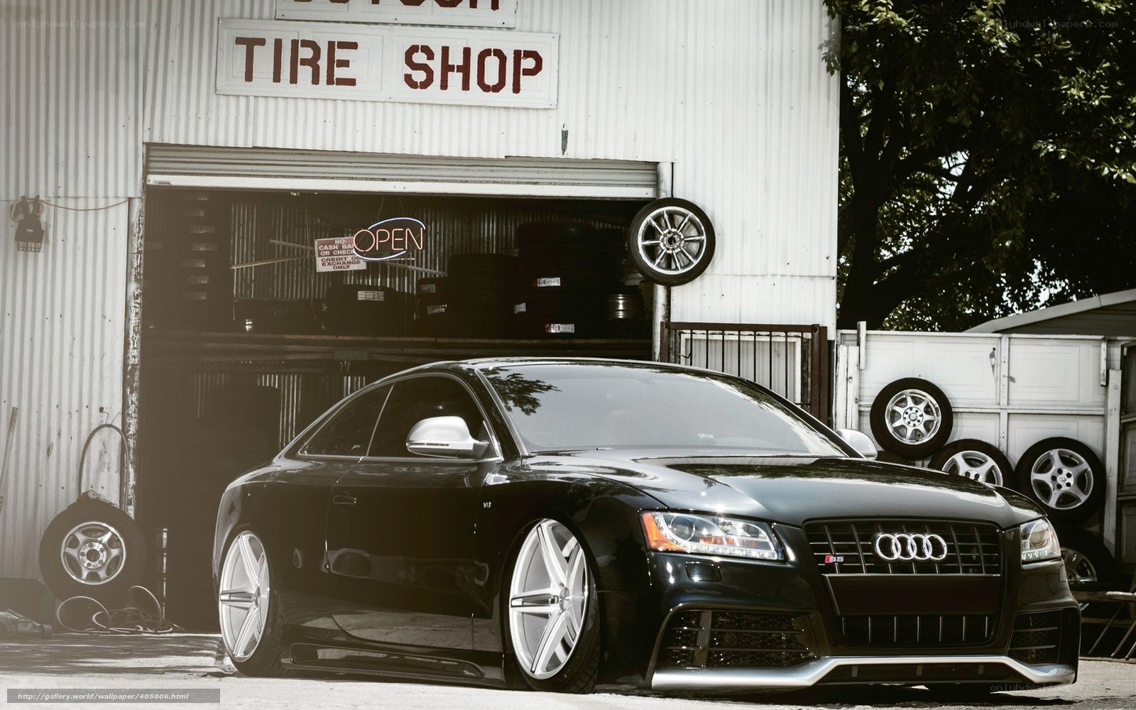 Black Audi in front of tire shop