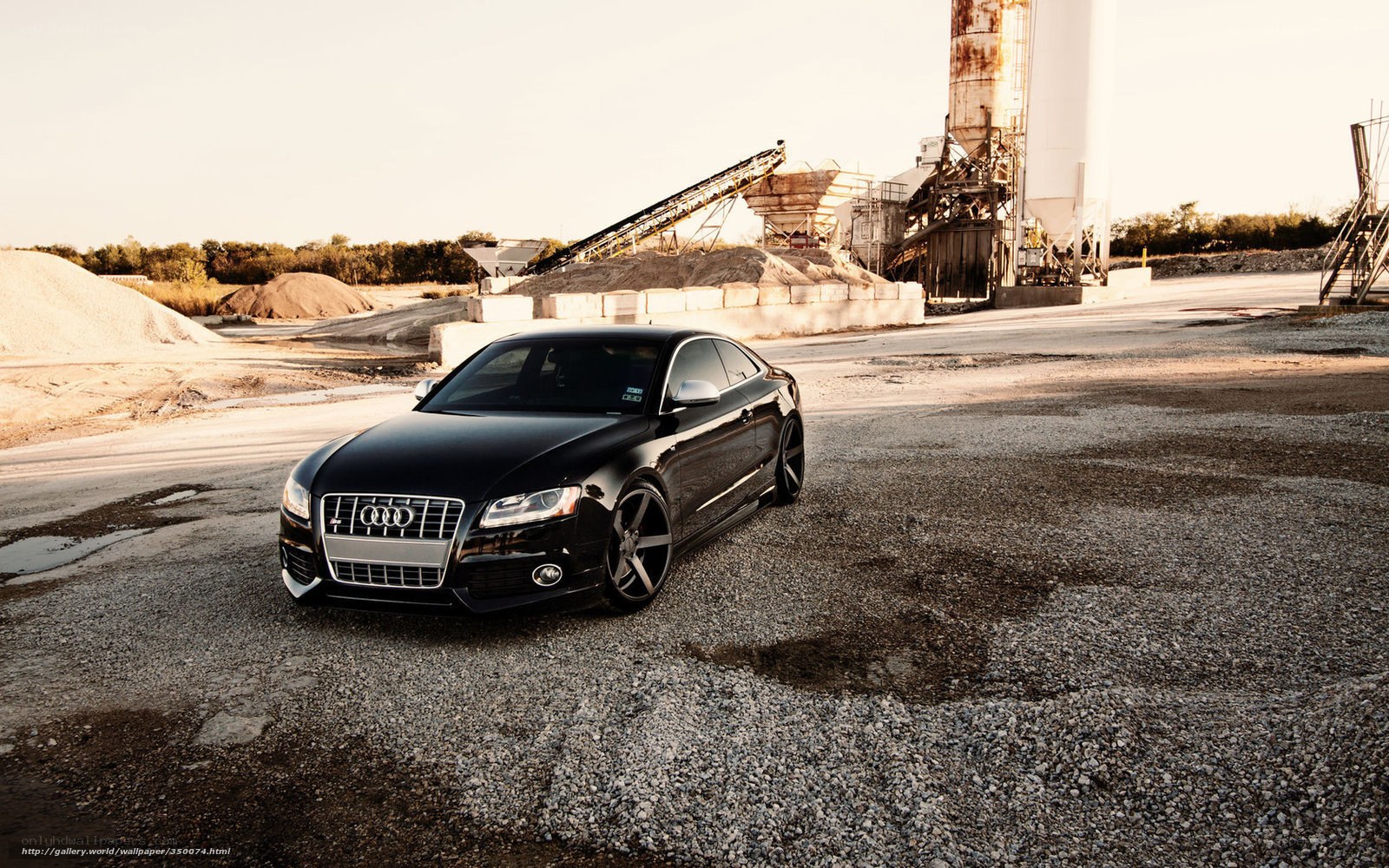 Black Audi in industrial setting