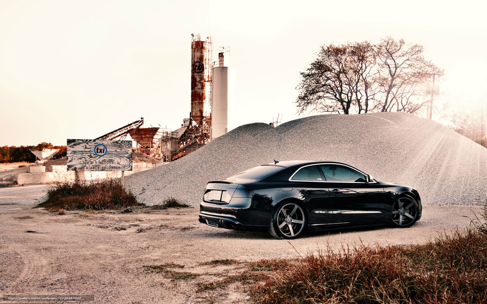 Black Audi in industrial setting