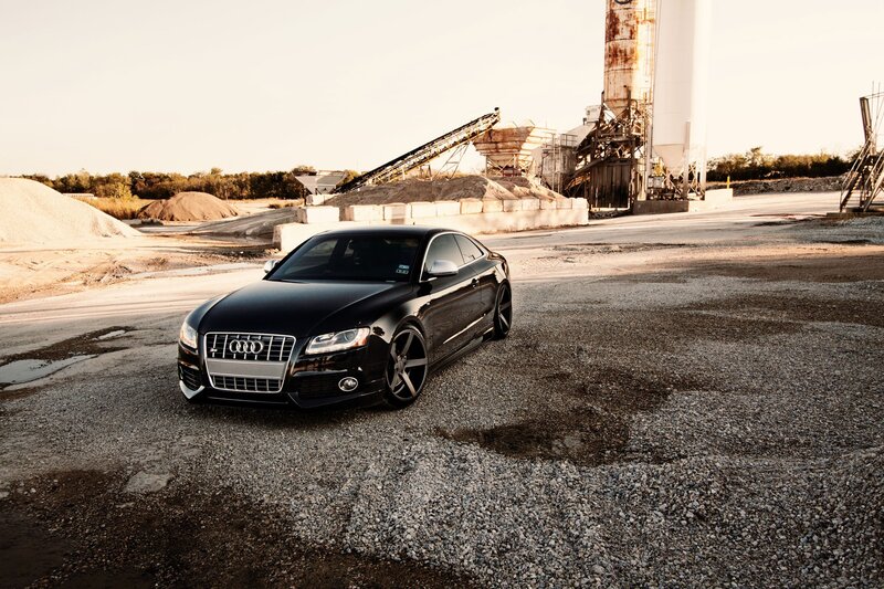 Black Audi in industrial setting