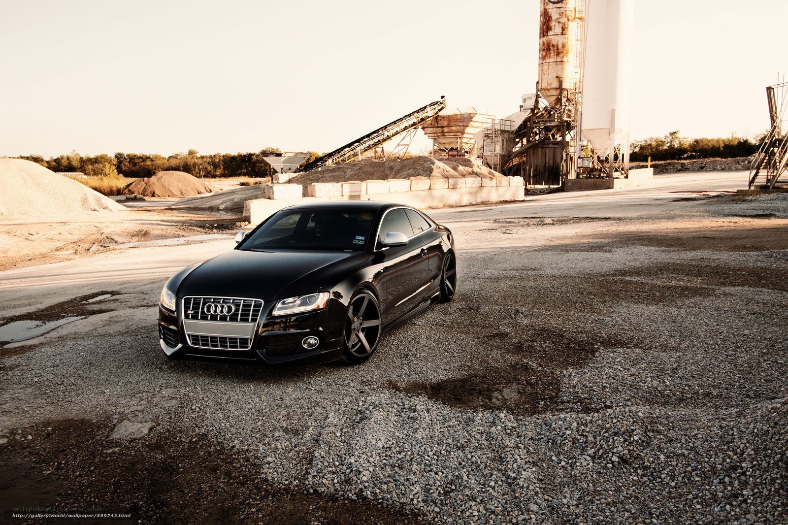 Black Audi in industrial setting