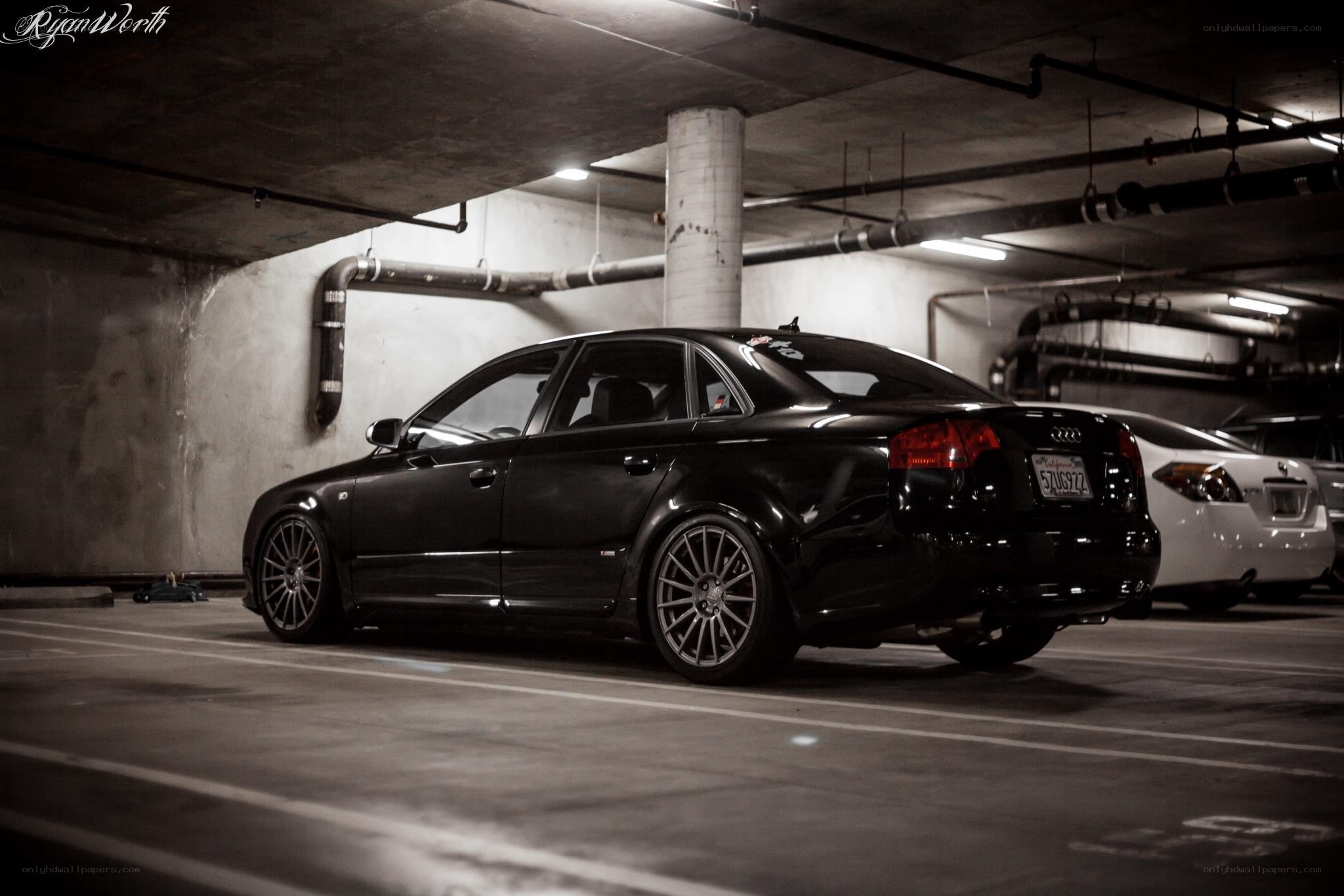 Black Audi in parking garage