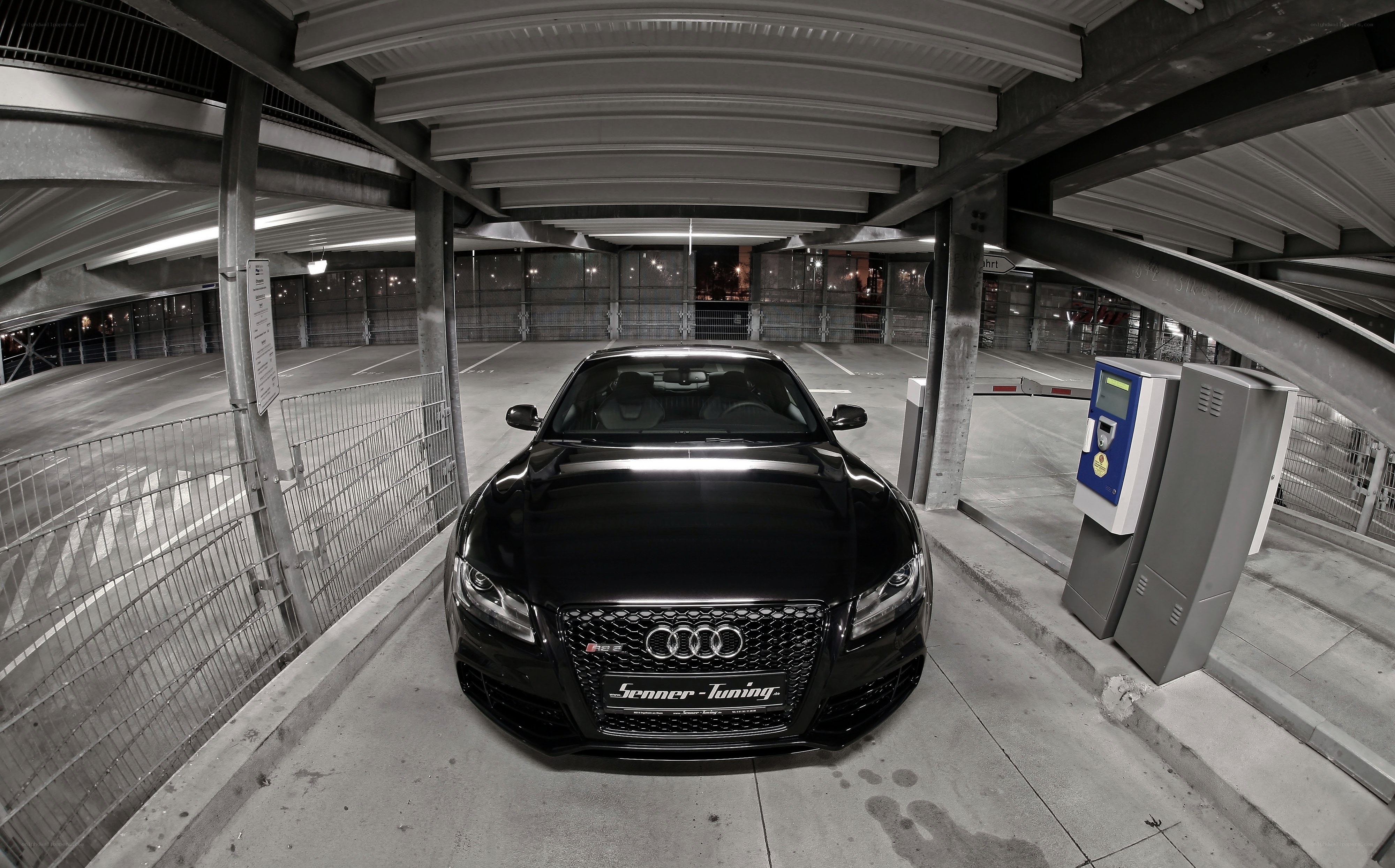 Black Audi in parking garage