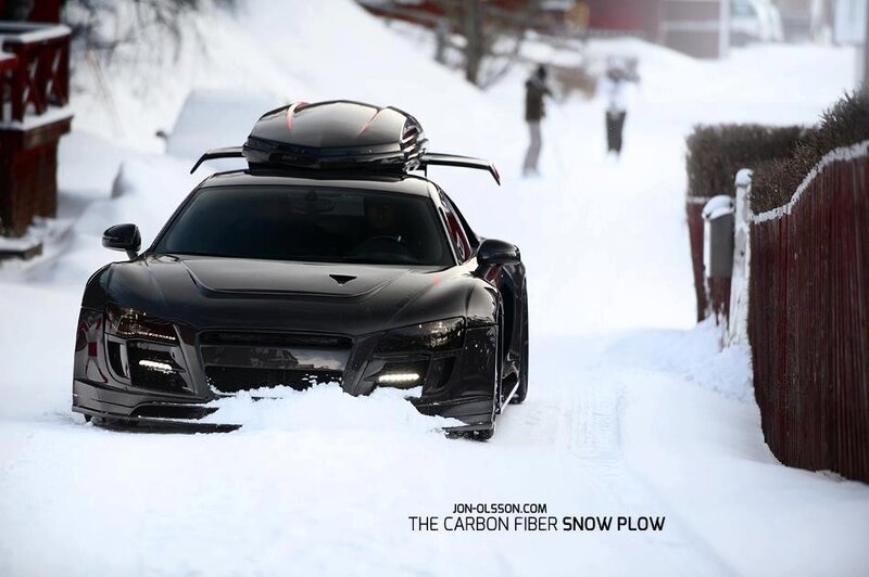 Black Audi in snow with roof box