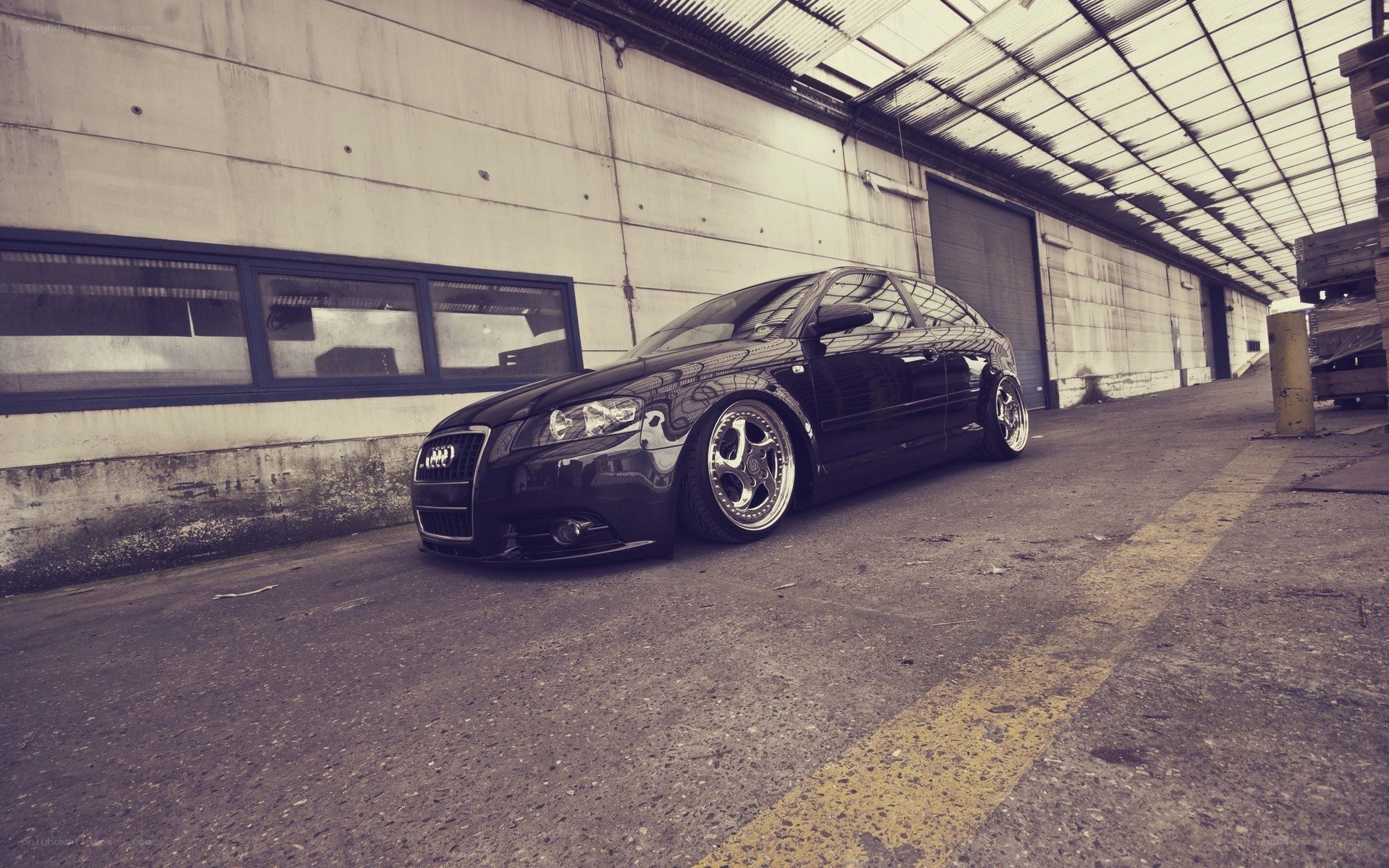 black audi in warehouse