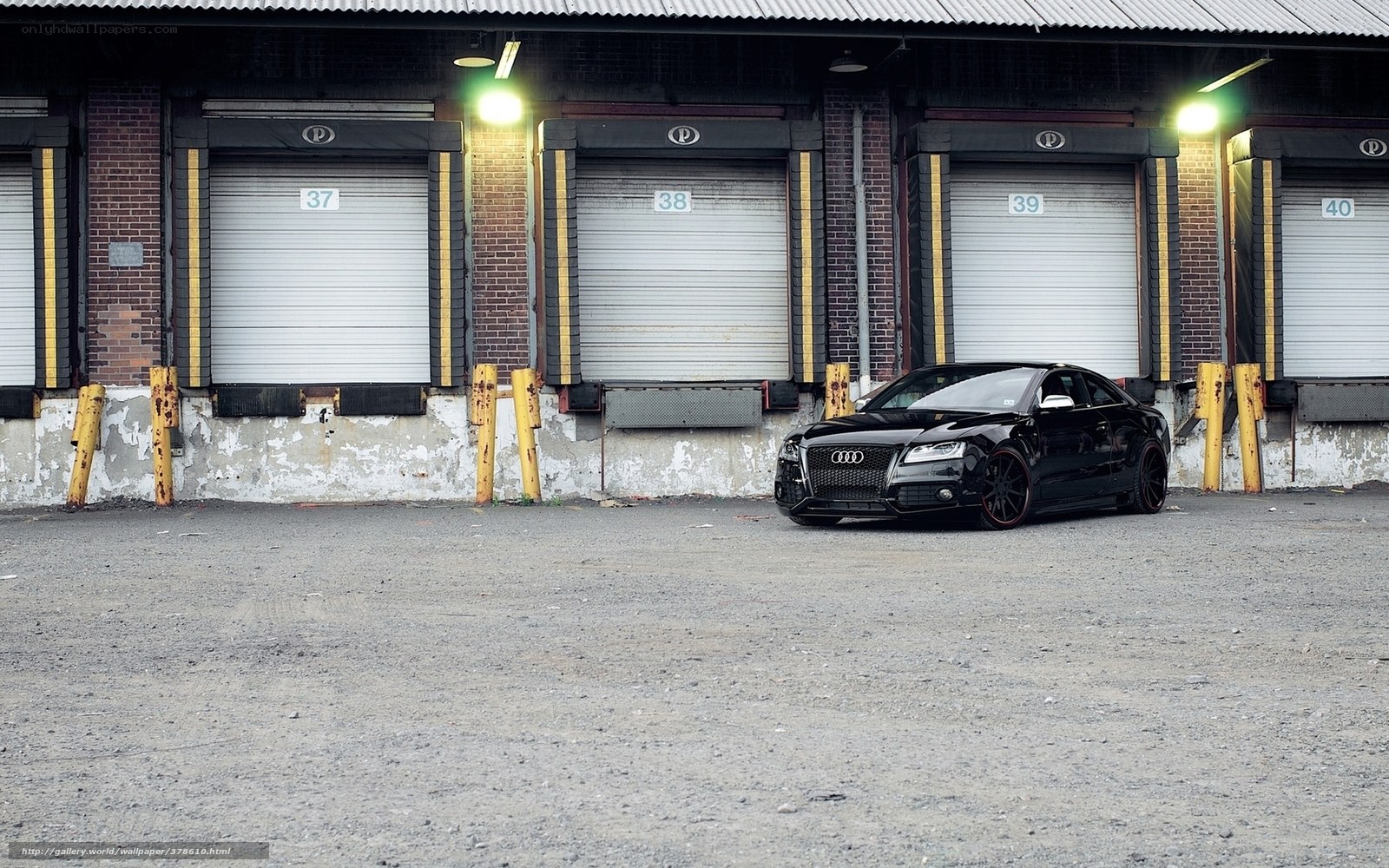Black Audi in warehouse lot