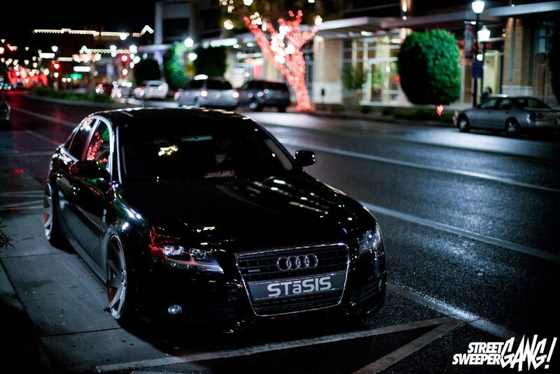 Black Audi on a city street at night
