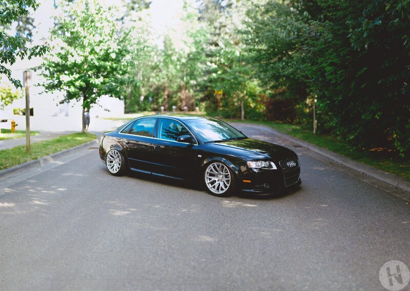 black audi on a quiet street