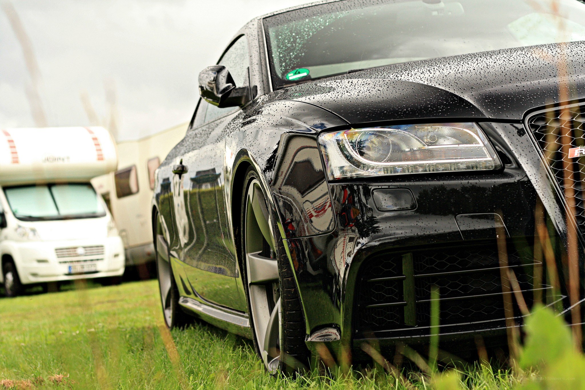 Black Audi on a rainy day