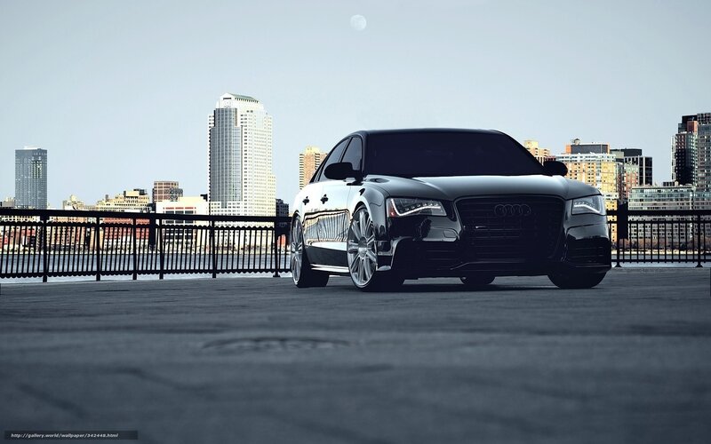 Black Audi on city waterfront