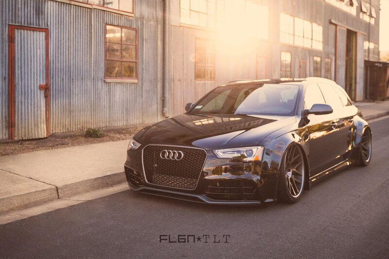Black Audi parked at sunset