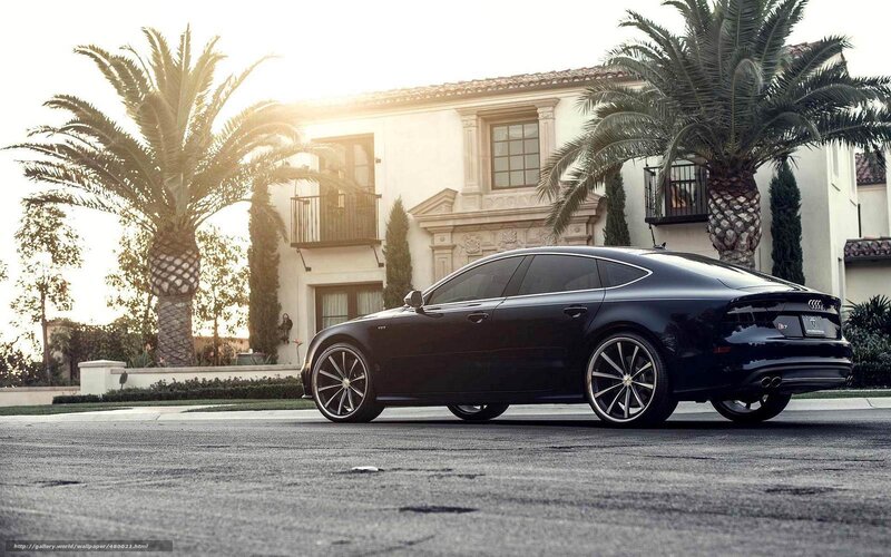 Black Audi parked in front of house