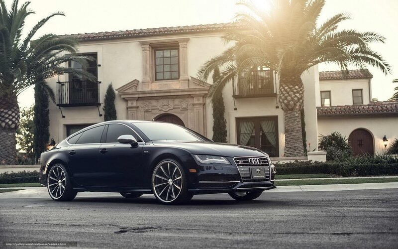 Black Audi parked in front of house