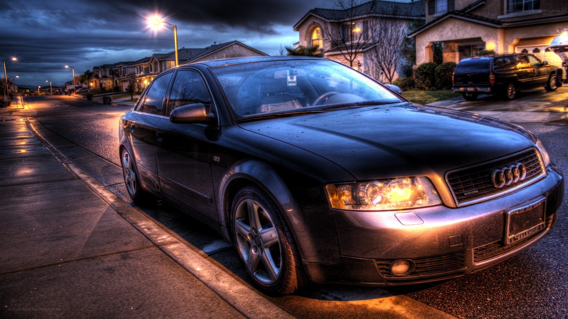 Black Audi parked on a street