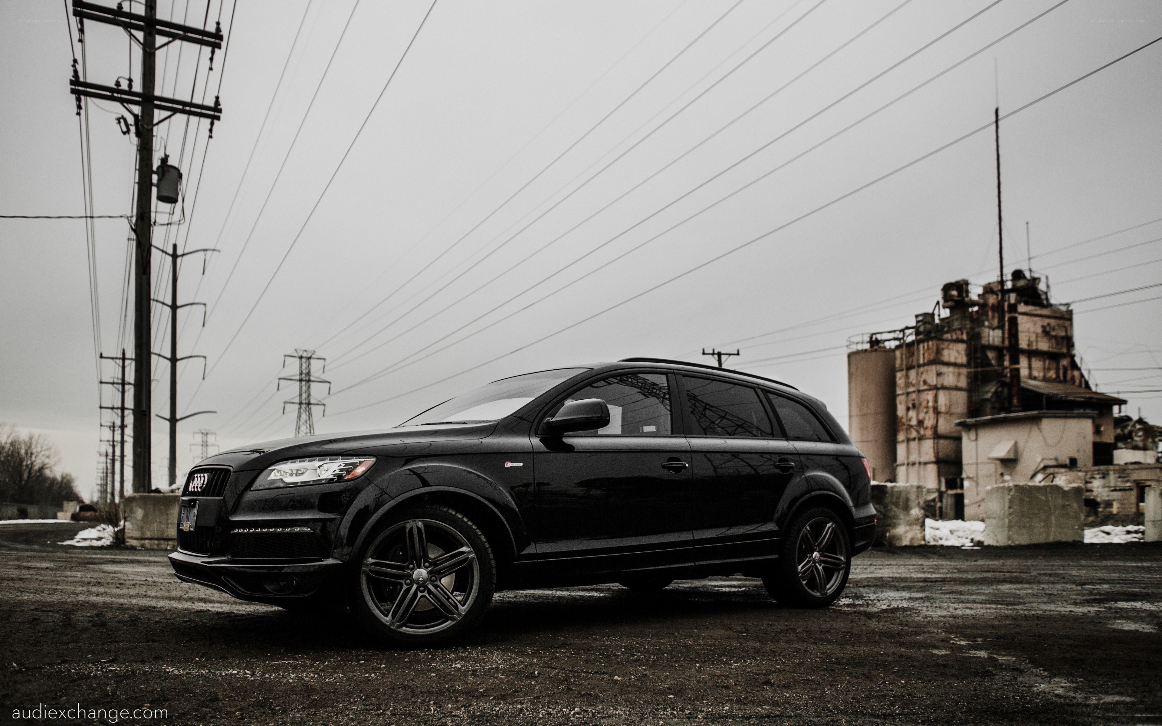 Black Audi Q7 in industrial setting