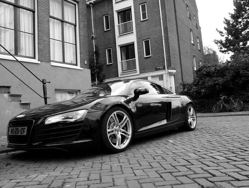 Black Audi R8 on a cobblestone street
