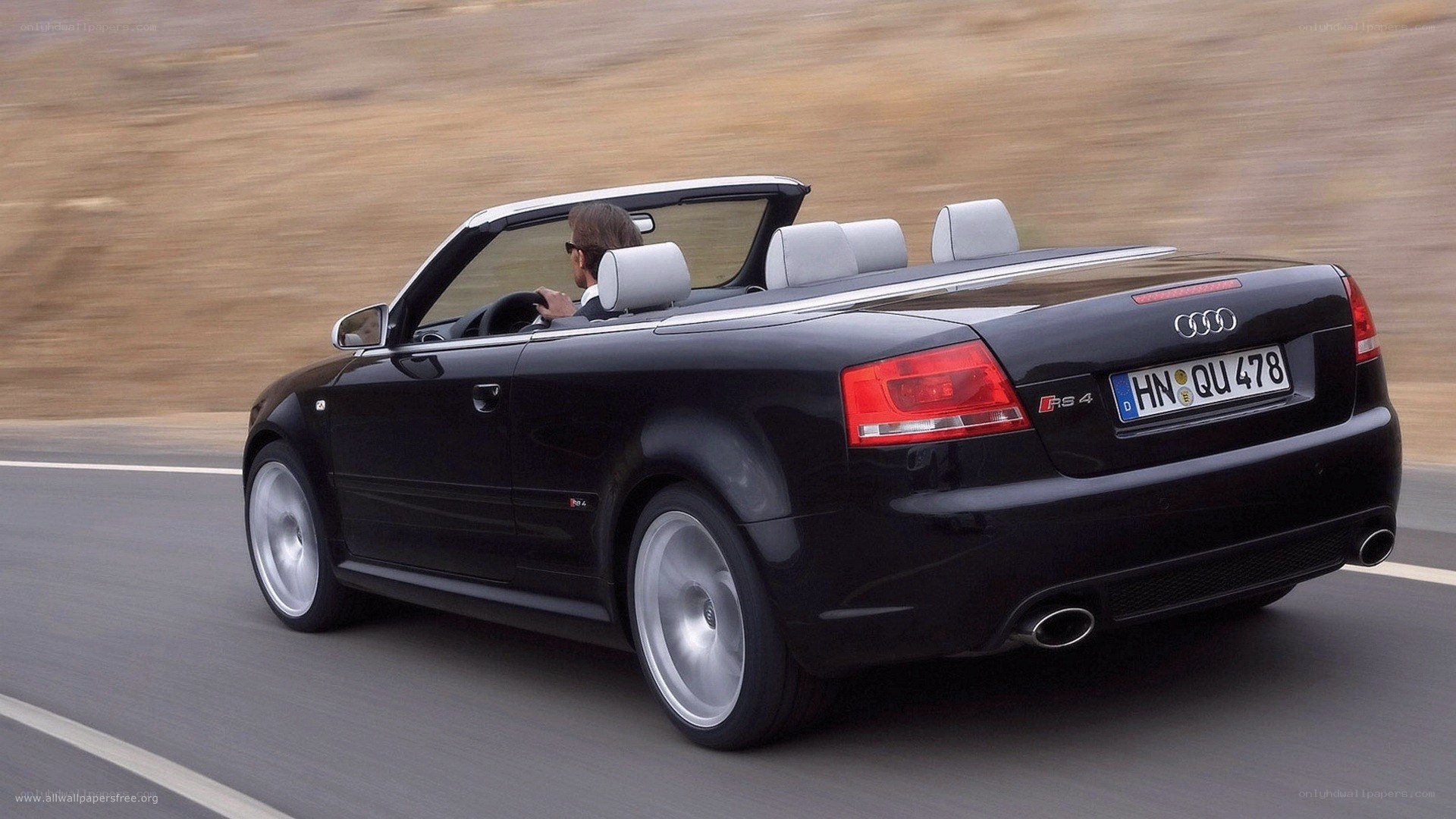 black audi rs4 convertible driving