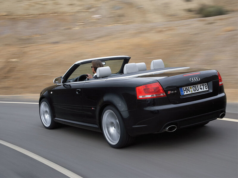 Black Audi RS4 convertible driving