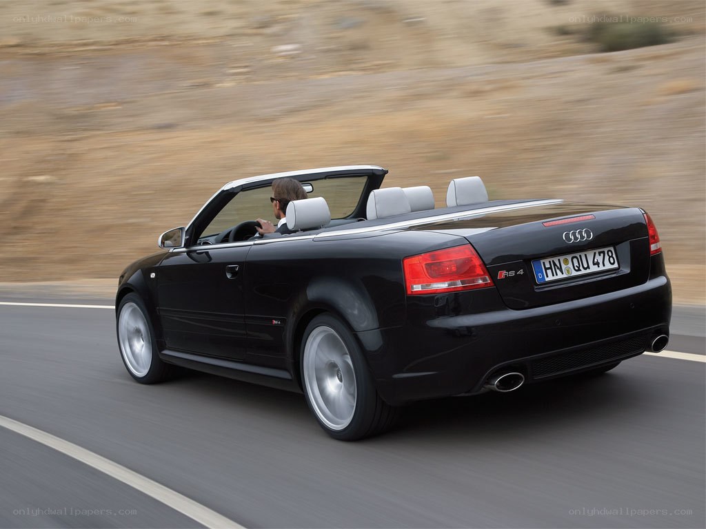 Black Audi RS4 convertible driving