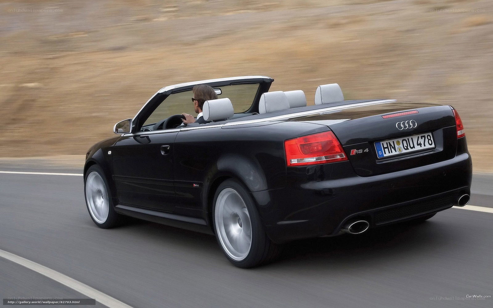 Black Audi RS4 convertible driving