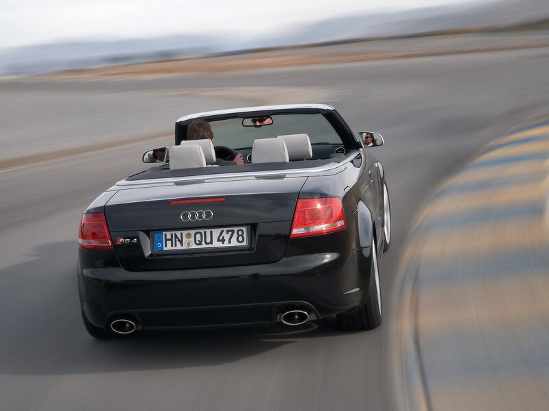 Black Audi RS4 convertible in motion