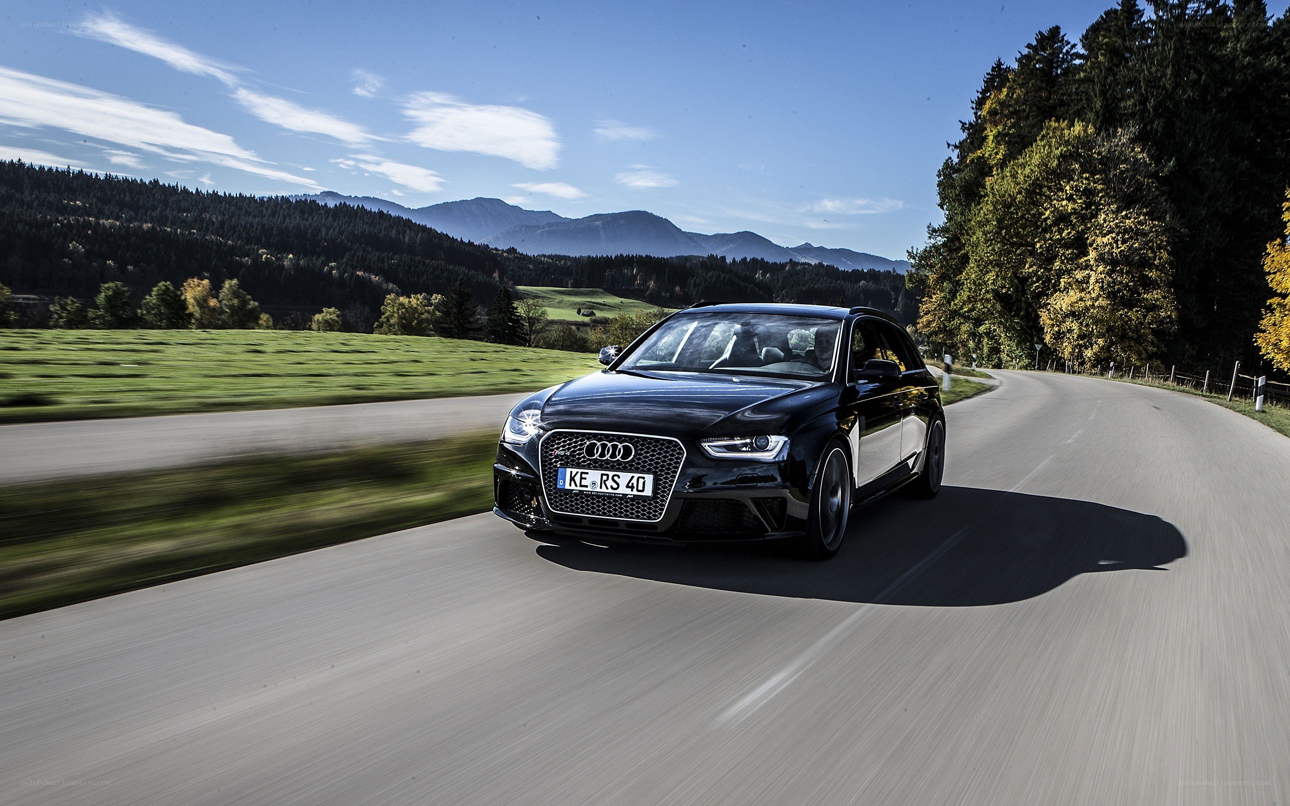 Black Audi RS4 on a winding road