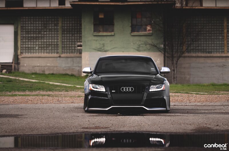 Black Audi RS5 in front of building