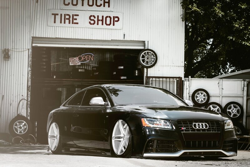 Black Audi S5 at tire shop