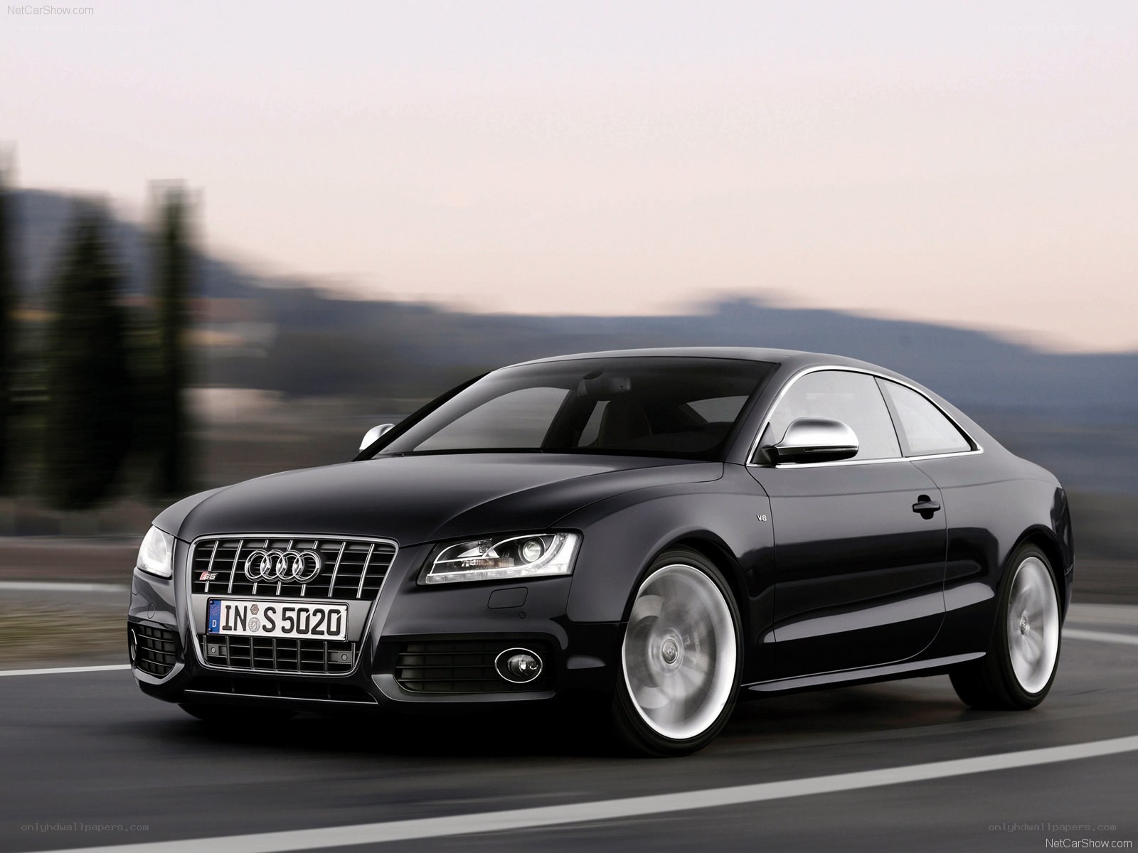 Black Audi S5 Coupe in motion