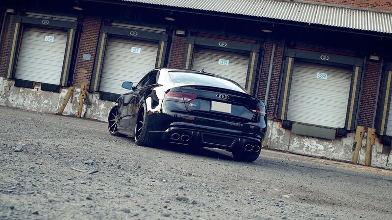 black audi s5 in industrial lot