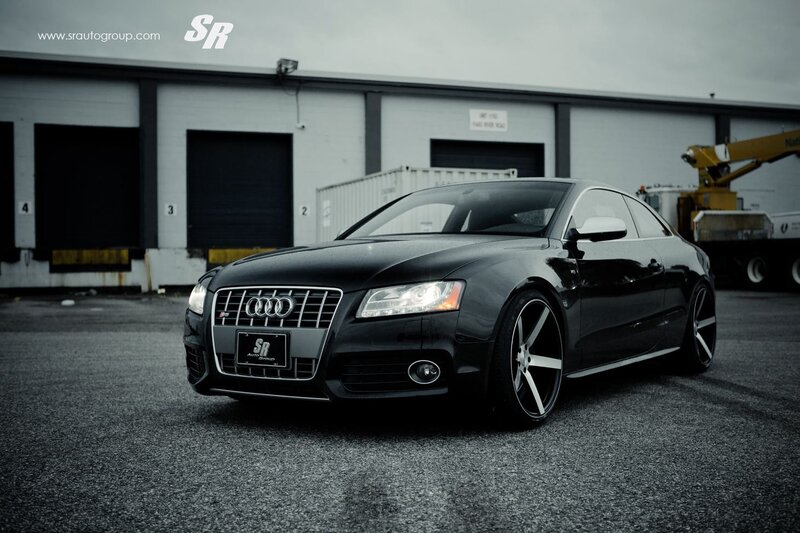 Black Audi S5 in industrial lot