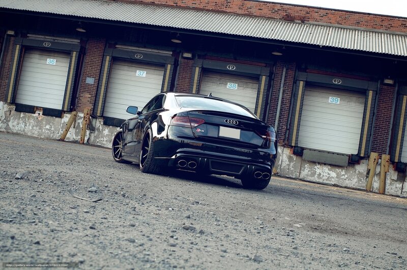 Black Audi S5 in industrial lot