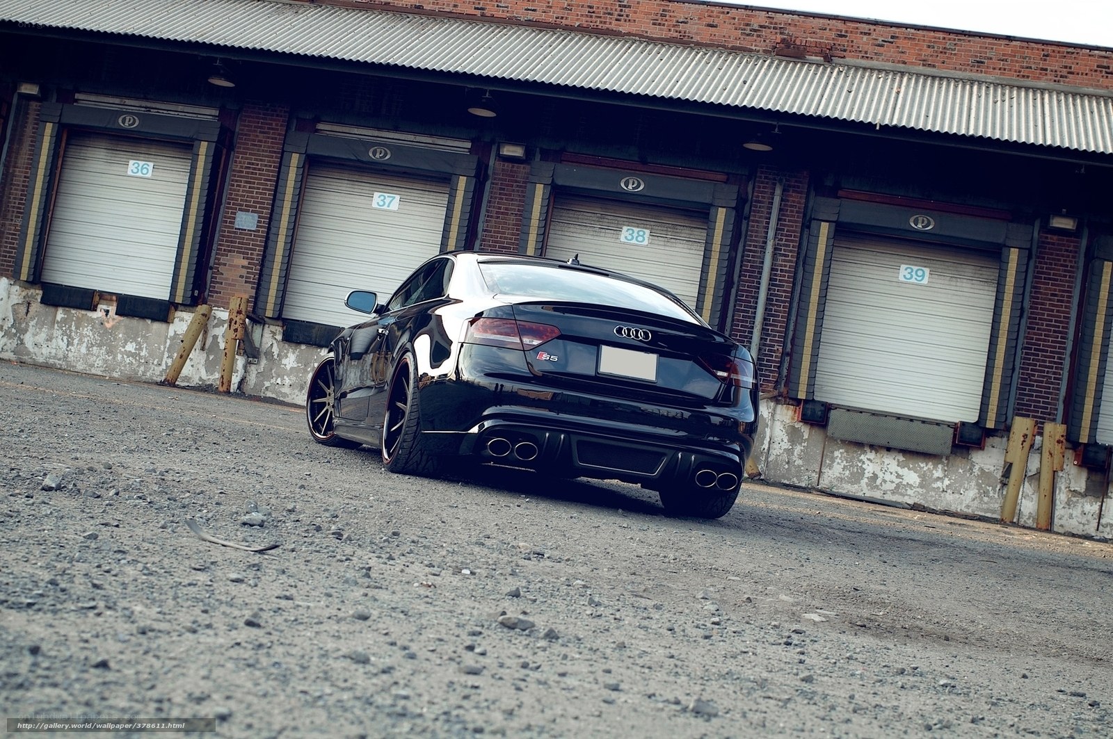 Black Audi S5 in industrial lot
