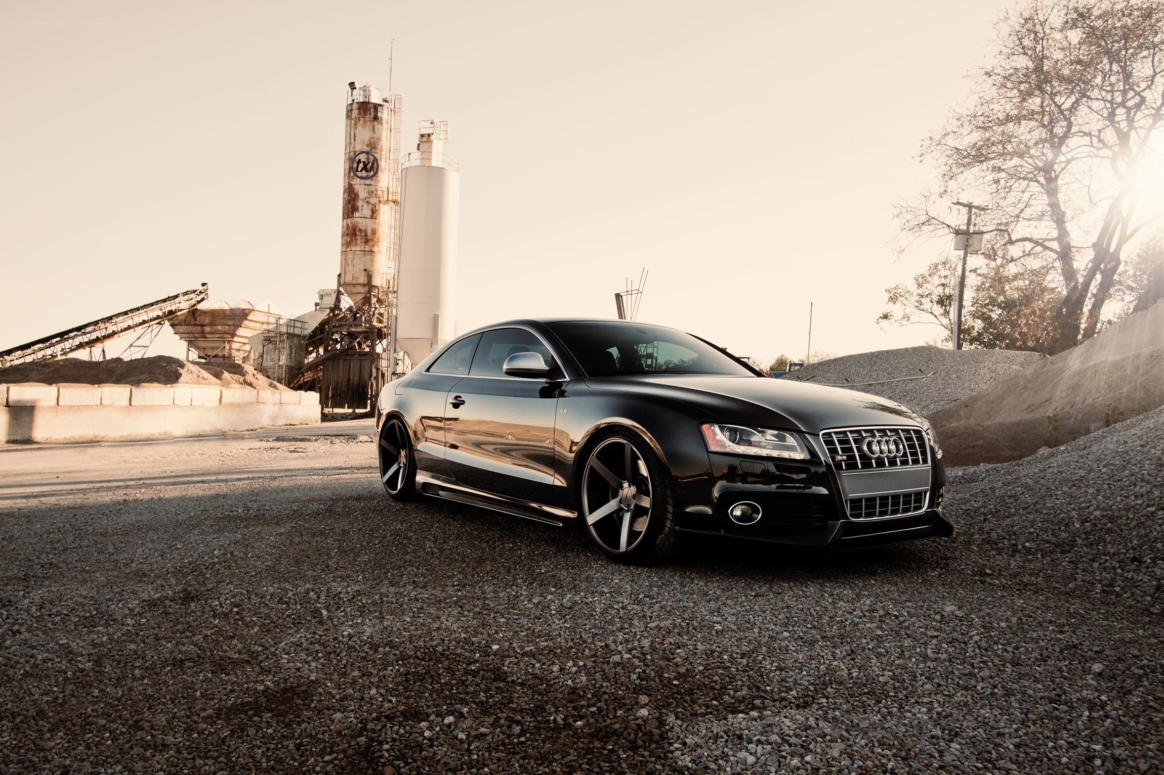 Black Audi S5 in industrial setting
