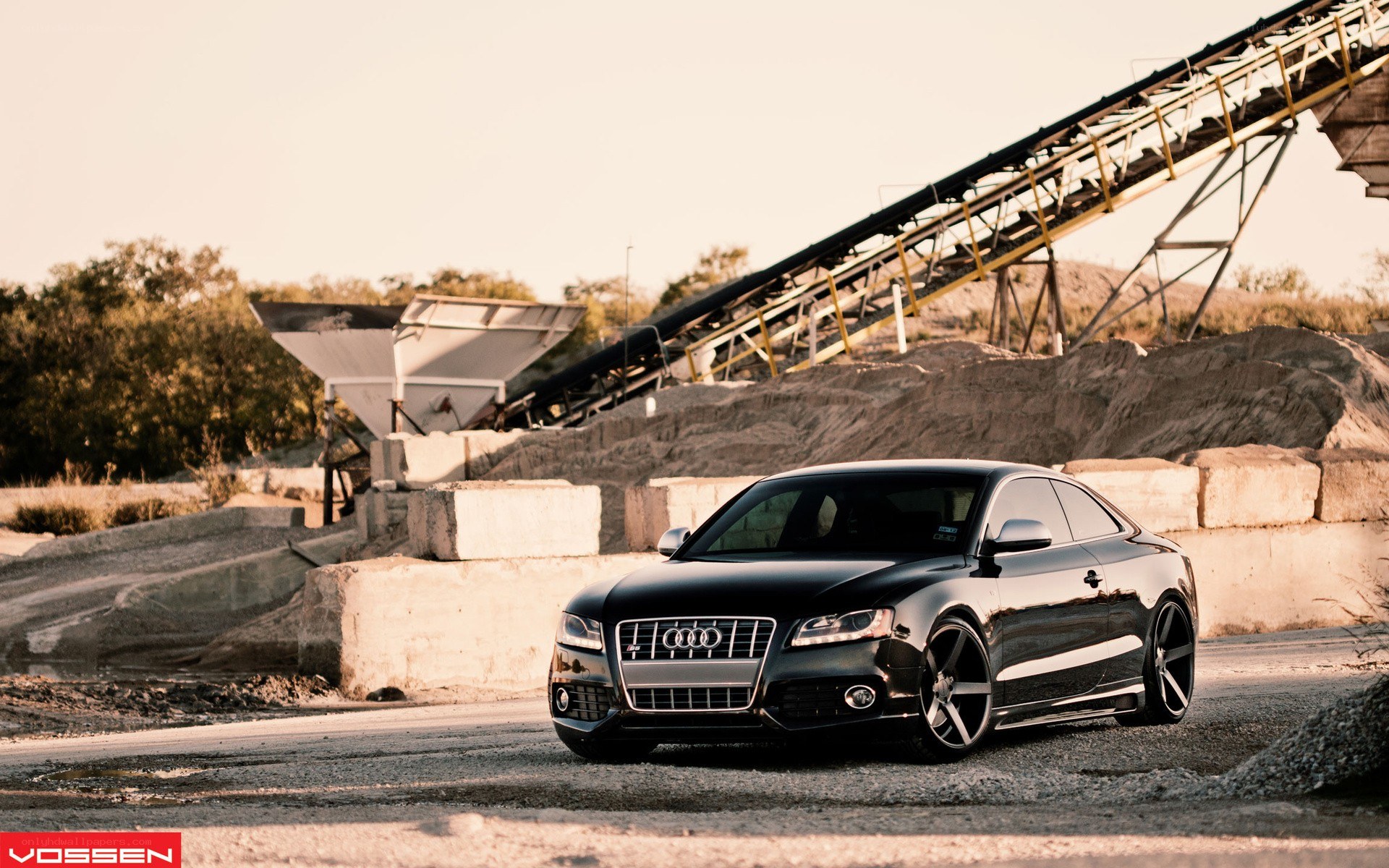 Black Audi S5 in industrial setting