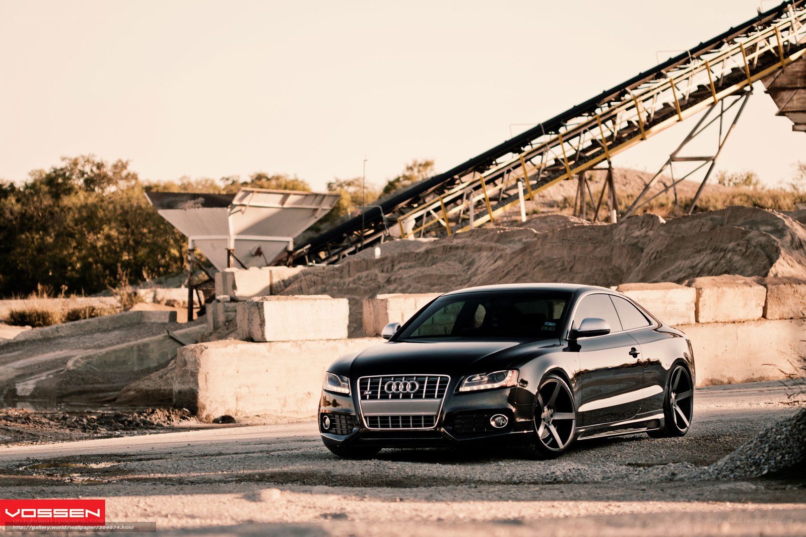 Black Audi S5 in industrial setting