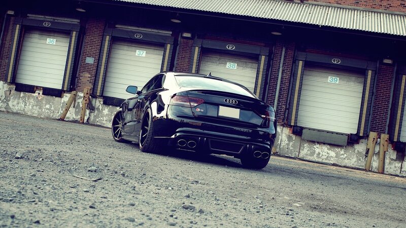 black audi s5 parked in alley