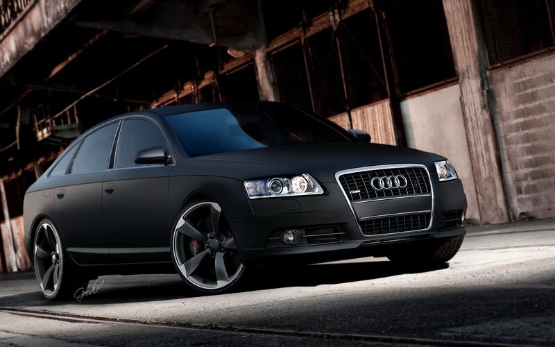 Black Audi S6 in industrial setting