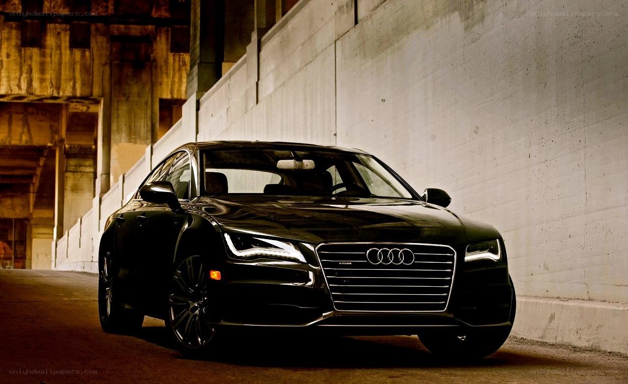 Black Audi sedan in tunnel